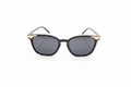 Black gold cat-eye sunglasses on white background