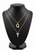 Q and Y Crystal Charm Necklaces on Black Jewelry Bust Holder