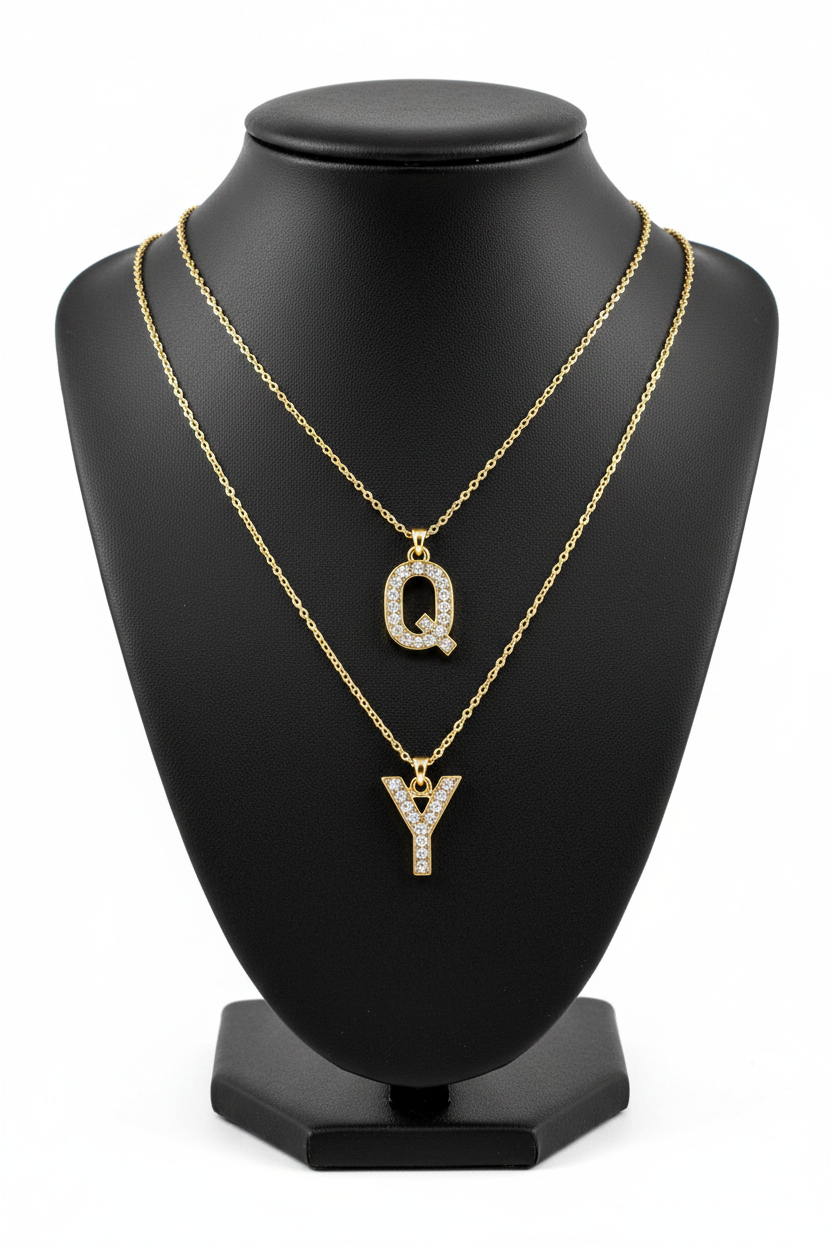 Q and Y Crystal Charm Necklaces on Black Jewelry Bust Holder
