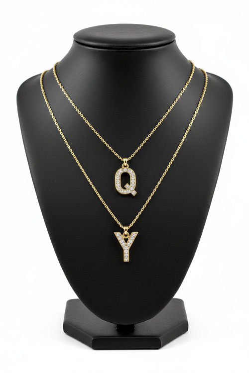 Q and Y Crystal Charm Necklaces on Black Jewelry Bust Holder